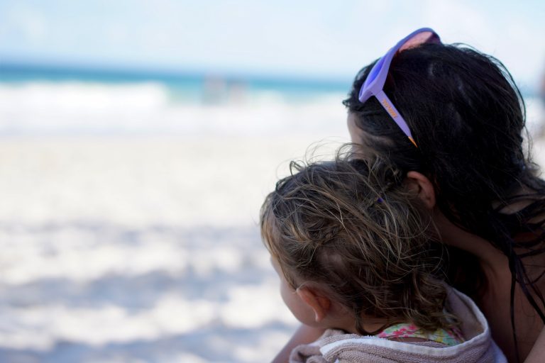 mother and daughter on a beach in Tulum