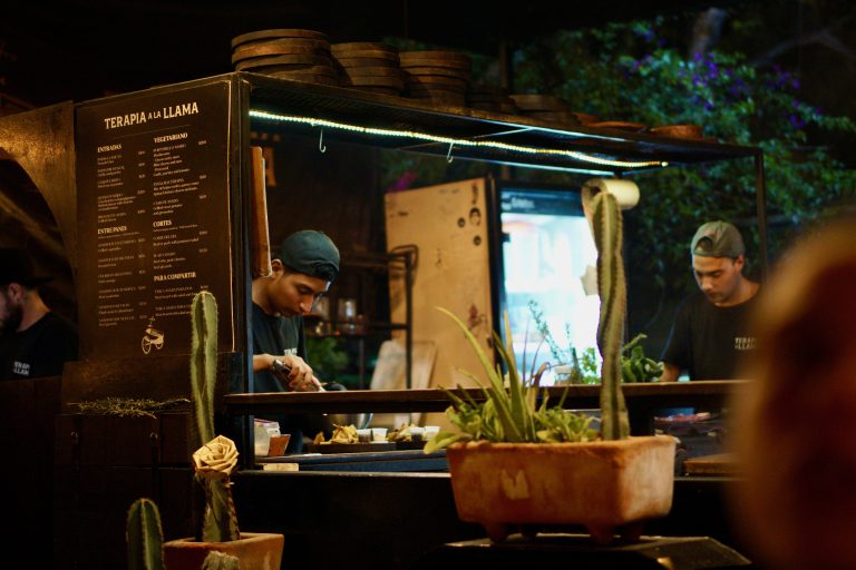 men making tacos at a food truck in Palma Central, Tulum